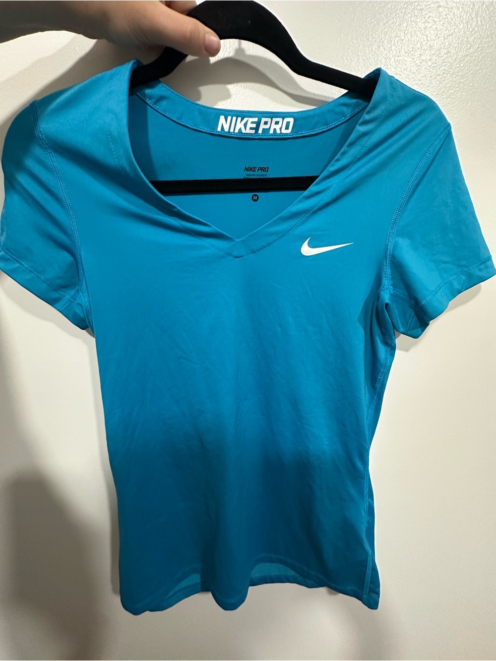 Nike Pro Women's Short-Sleeve V-Neck Top in Teal Blue